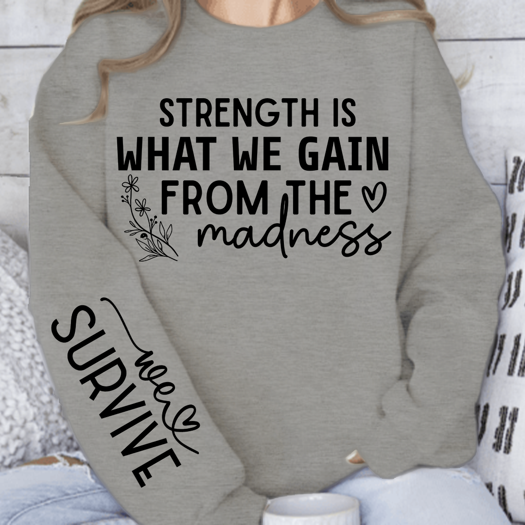 Sweatshirt Unisex Strength Is What We Gain From The Madness